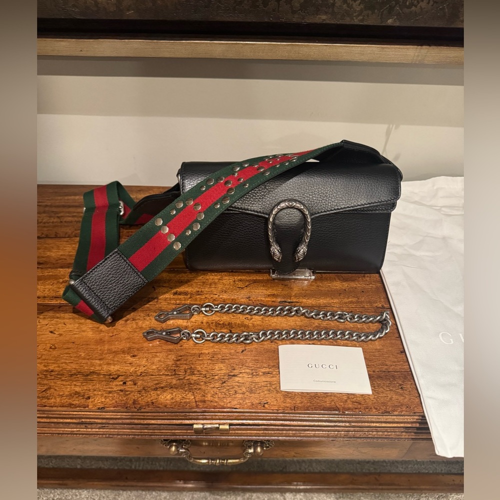 Gucci Handbag with Reversible Wide Strap and an interchangeable chain strap.